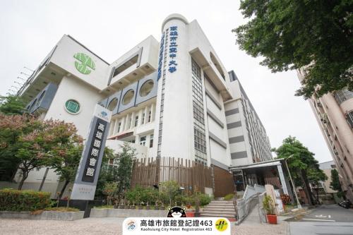 a building with a sign on the front of it at Kaohsiung International Plaza in Kaohsiung