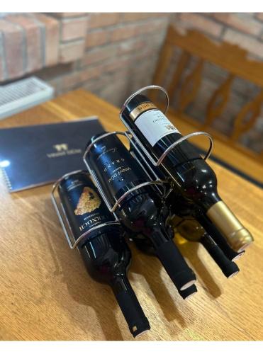 a bottle of wine sitting on top of a table at Sklep u Dušana in Vracov
