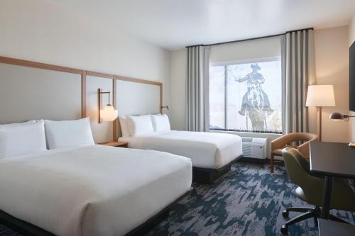 a hotel room with two beds and a window at Fairfield by Marriott Inn & Suites Tempe in Tempe