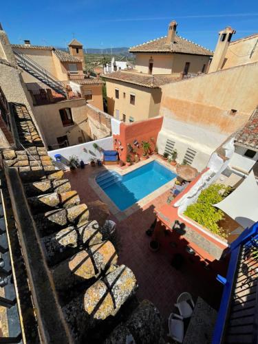 an aerial view of a house with a swimming pool at Casa Morayma, Lecrin, Granada (Adult Only Small Guesthouse) in Acequias
