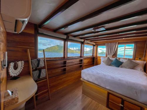 a bedroom with a bed in a boat at DAV Travels in Labuan Bajo