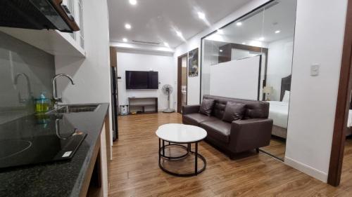 a living room with a couch and a table at Phong Lan Apartments in Hai Phong