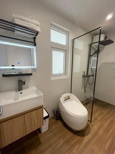 Ein Badezimmer in der Unterkunft The CK Hotel