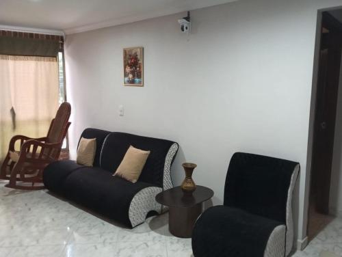 a living room with a couch and two chairs at Habitación # 1 Moderna y Cómoda in Bello