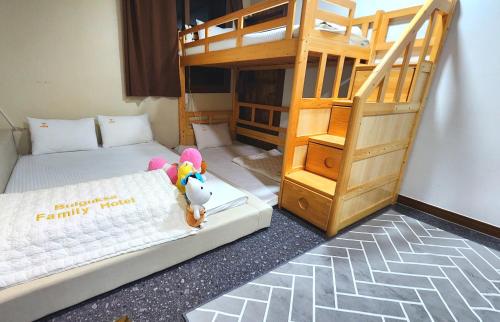 a room with two bunk beds and a bunk bed at GyeongJu Kids & Family Hotel in Gyeongju