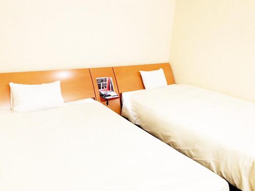 two beds sitting next to each other in a room at Hashima - Hotel - Vacation STAY 52815v in Hashima
