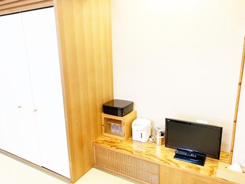 a hotel room with a television and a microwave at Hashima - Hotel - Vacation STAY 52815v in Hashima