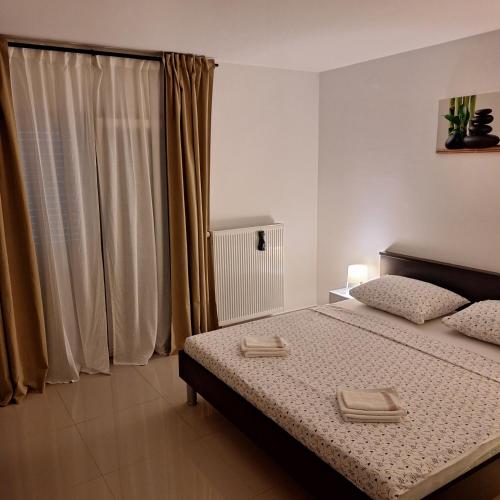 Ένα ή περισσότερα κρεβάτια σε δωμάτιο στο APARTMAN KIARA