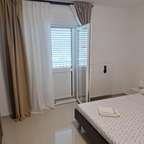 Ένα ή περισσότερα κρεβάτια σε δωμάτιο στο APARTMAN KIARA