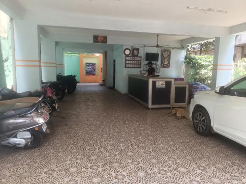 a hallway with two motorcycles parked in a room at Sapthagiri lodge in Visakhapatnam