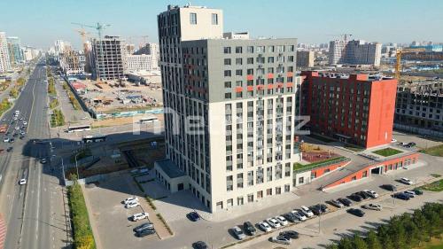 an overhead view of a large white building in a city at Больница Управ делами президента , IT Университет, Центр репродукции, Экспо Mega Silkway, Аэропорт in Prigorodnyy