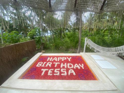 a birthday cake sitting on top of a table at Exotic Private Glamping in Nusa Penida