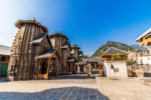 a large stone building with at Lemonade Inn in Chamba