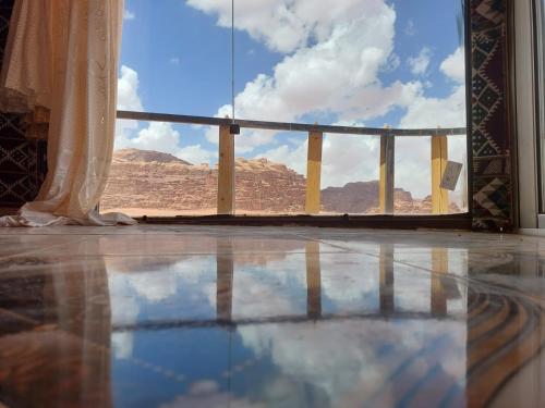 a room with a window with a view of a mountain at joy of life in Wadi Rum