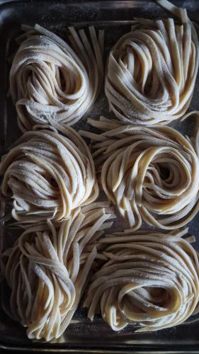 a tray filled with noodles in at Podere Pievina Delle Corti - Dimora di Campagna in Sinalunga
