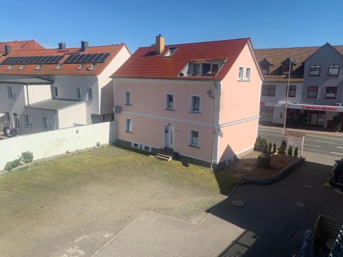 an aerial view of a building with a parking lot at Hotel Carl von Clausewitz in Leipzig