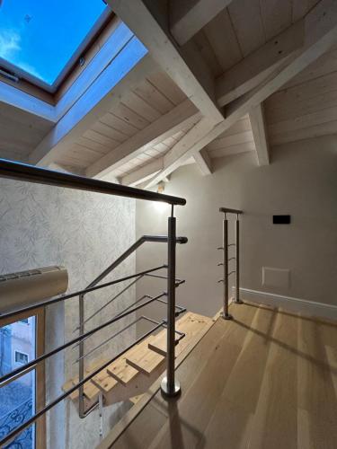 a staircase in a loft with a skylight at Elisabetta1 Guesthouse Sassari in Sassari