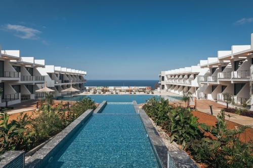 an image of the swimming pool at the resort at Pearl Island Holiday Homes in Kérynia