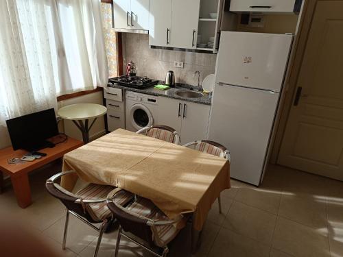Kuchyň nebo kuchyňský kout v ubytování Sirman Apart Hotel