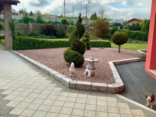 a garden with a dog and a fire hydrant at Dům Stašov in Stašov