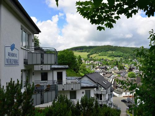 a hotel with a view of a town at Magnificent Apartment in Willingen with Balcony in Willingen
