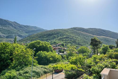 a view of a village in the hills at RELAX apartment Split area with private jacuzzi on terrace with mountain view in Srinjine