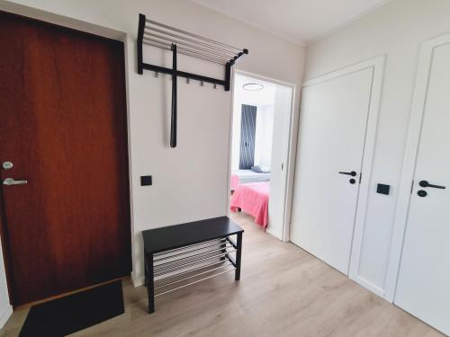 a room with a door and a cross on the wall at Räpina Apartment in Räpina