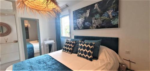 Ένα ή περισσότερα κρεβάτια σε δωμάτιο στο Appartement les Issambres