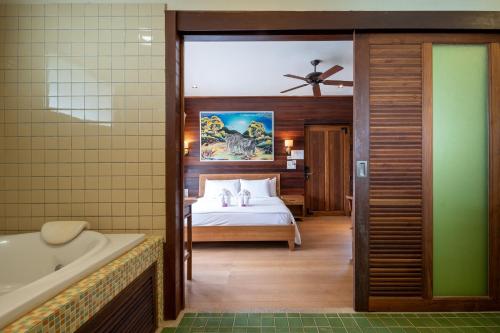 Postel nebo postele na pokoji v ubytování GajaPuri Resort Koh Chang