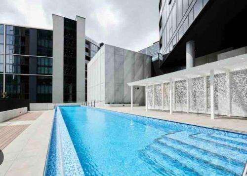 a swimming pool on the roof of a building at Spacious 2 bedroom apartment-free parking-pool-gym-wi-fi in Belconnen