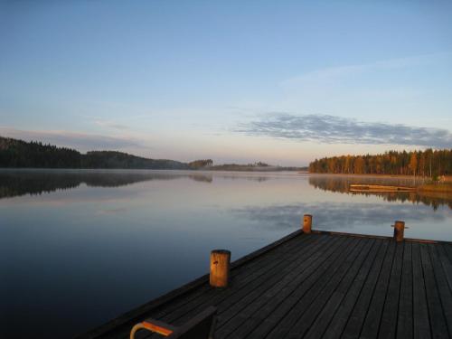 a view of a dock on a lake at Saimaanranta Resort by Anttolanhovi in Mikkeli