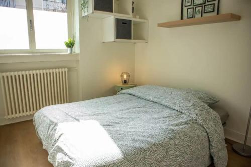 Ένα ή περισσότερα κρεβάτια σε δωμάτιο στο Studio Cosy et idéalement placé