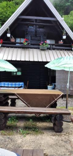 a ping pong table in front of a house at Apartmani Dada Kanjon Grmuša in Bihać