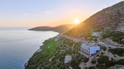 an aerial view of a building on a hill next to the ocean at Vila Bana in Qeparo
