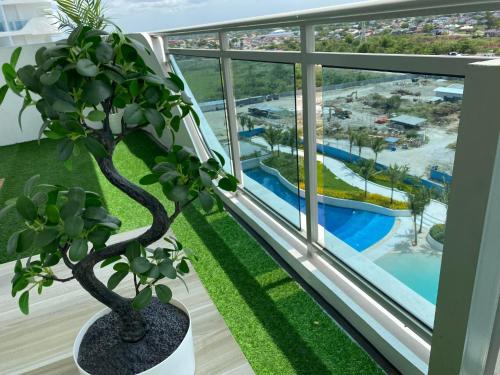 a balcony with a view of a pool at Muji Inspired Beach view in San Fernando