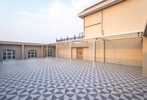 an empty building with a black and white tiled floor at Enrise by Sayaji Lonavala in Lonavala