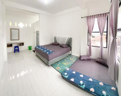 Katil atau katil-katil dalam bilik di Lansogo Homestay
