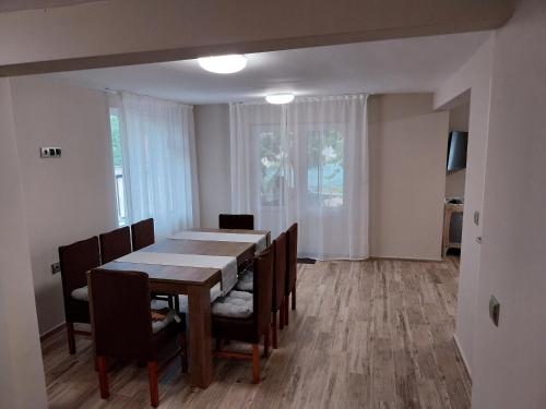 a dining room with a table and chairs at Villa Stela Mare in Sunny Beach