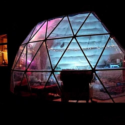 a glass window with a view of the ocean at Waipu Off-grid Eco Geodesic Glamping Dome in Waipu