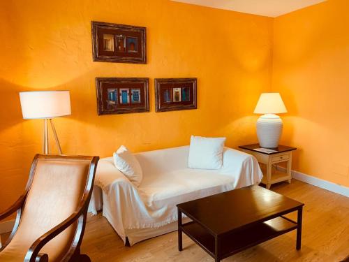 a living room with a couch and a table at Apartamentos Rincón del Puerto in San Vicente de la Barquera