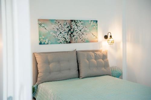 En eller flere senge i et værelse på Dream Villas Holidays