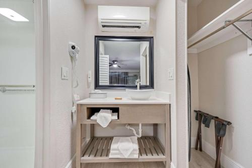 a bathroom with a sink and a mirror at Quality Inn & Suites Airport-Cruise Port Hollywood in Hollywood