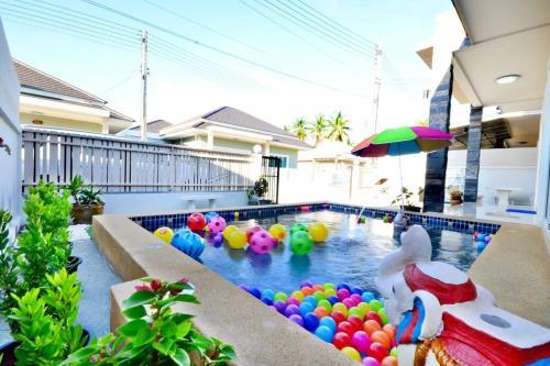 a pool with a bunch of balls and a bunny in it at The Guestvilla644 in Hua Hin