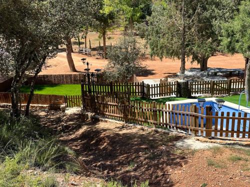 a wooden fence in front of a park at VILLAS LAS LAGUNAS 1 in Ossa de Montiel