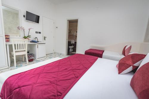 Postel nebo postele na pokoji v ubytování Hotel San Pietro