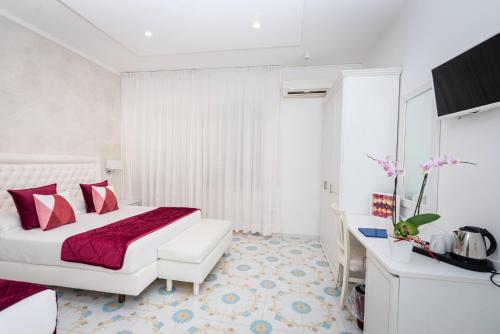 Postel nebo postele na pokoji v ubytování Hotel San Pietro