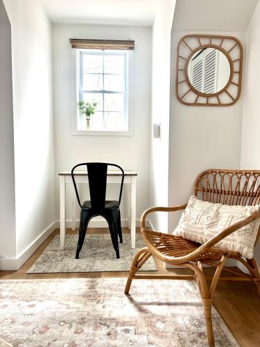 a living room with a chair and a table at Catskill Cabin with Firepit & Brilliant Fall Views in Catskill