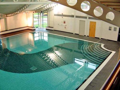 a large swimming pool in a building at 26 Sherwood, South Lakeland Leisure Village in Carnforth