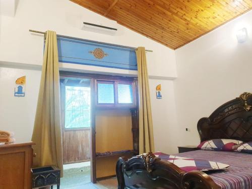 a bedroom with a bed and a window at CASA dreams Chaouen in Chefchaouene
