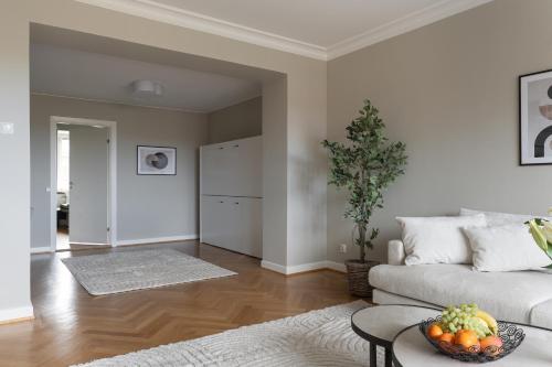 a living room with a couch and a table at Live and Stay VR40 in Gothenburg